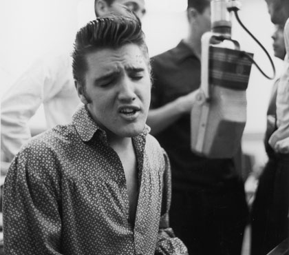 Elvis-Presley-crooning-for-Sam-Phillips-Sun-Records-circa-1955.3.jpg