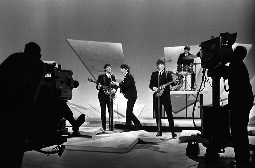 New York -- Seventy-million American televiewers sa the Beatles last night in action and heard the shrieks of an excited studio audience . . . . (New York Daily News)